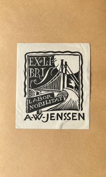 ExLibris by artist Per Kramer Jr. for the engineer A. W. Jenssen. The linocut print shows a road bridge and the phrase "Labor Nobilitat". Behind the bridge, a huge sun sits in the upper right corner. The artist's initials, P. K., are nestled behind a flimsy tree, buffeted by the wind. 